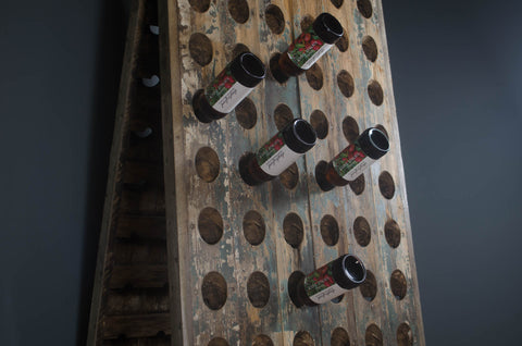 Reclaimed wine bottle riddler stands