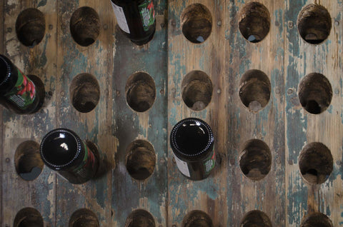 Reclaimed wine bottle riddler stands