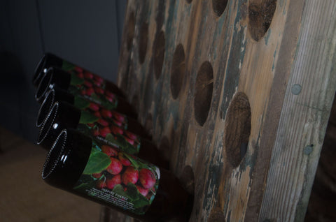 Reclaimed wine bottle riddler stands