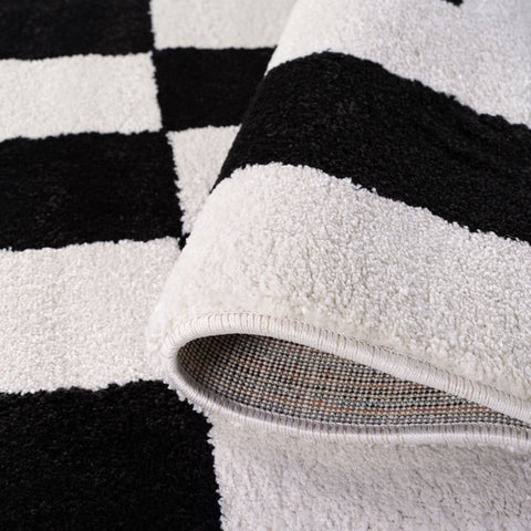 Joli tapis géométrique noir et blanc