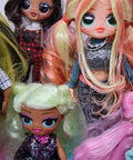 Group of colorful dolls with unique hairstyles and outfits.