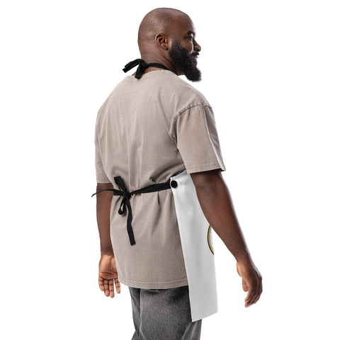 Plain reverse of the white Chicken on a Bicycle kitchen apron, showing black twill ties and fasteners