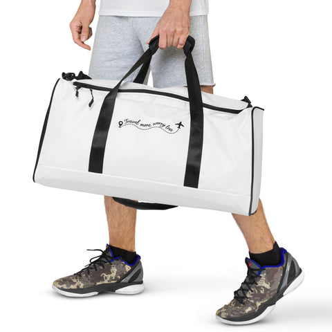 Travel More Worry Less white 50 litre duffle bag with black handles and strap – front lifestyle view