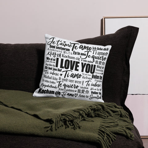 Love in Every Language 18-inch premium white pillow with large black multilingual typography – front lifestyle view