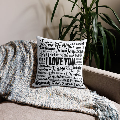 Love in Every Language 18-inch premium white pillow with large black multilingual typography – front room view