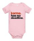 Pink baby bodysuit with original rust-orange and black Karma Has No Deadline lettering on the front – ZIPZAPPA