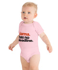 Pink baby bodysuit with original rust-orange and black Karma Has No Deadline lettering on the front – ZIPZAPPA