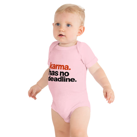 Pink baby bodysuit with original rust-orange and black Karma Has No Deadline lettering on the front – ZIPZAPPA