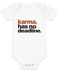White baby bodysuit with original rust-orange and black Karma Has No Deadline lettering on the front – ZIPZAPPA
