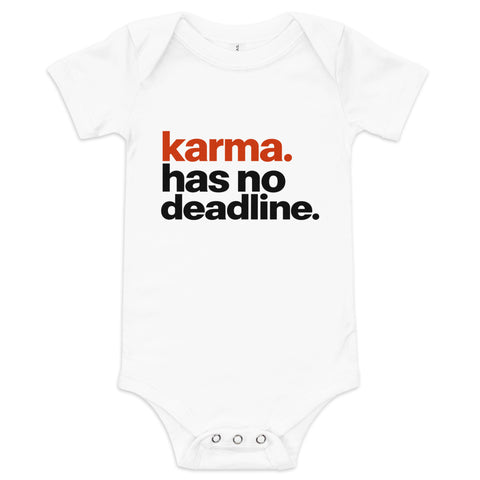 White baby bodysuit with original rust-orange and black Karma Has No Deadline lettering on the front – ZIPZAPPA