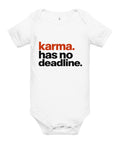 White baby bodysuit with original rust-orange and black Karma Has No Deadline lettering on the front – ZIPZAPPA