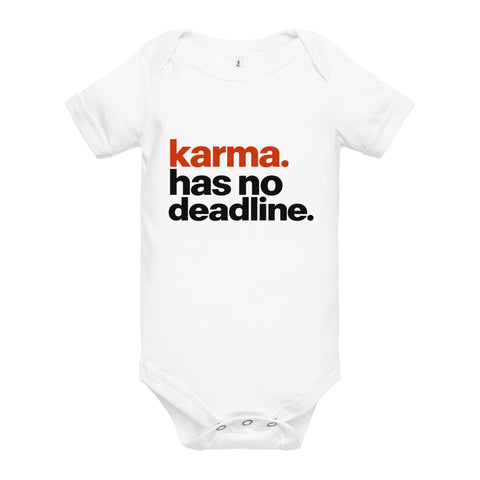 White baby bodysuit with original rust-orange and black Karma Has No Deadline lettering on the front – ZIPZAPPA