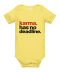 Yellow baby bodysuit with original rust-orange and black Karma Has No Deadline lettering on the front – ZIPZAPPA