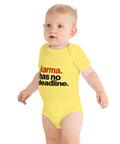 Yellow baby bodysuit with original rust-orange and black Karma Has No Deadline lettering on the front – ZIPZAPPA