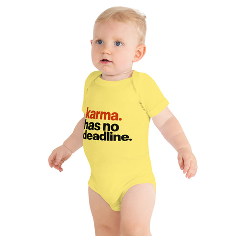 Yellow baby bodysuit with original rust-orange and black Karma Has No Deadline lettering on the front – ZIPZAPPA