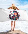 White 30 × 60 inch beach towel with original colourful Psychedelic Sunset Cat artwork centred on the front – beach mockup 1 – ZIPZAPPA