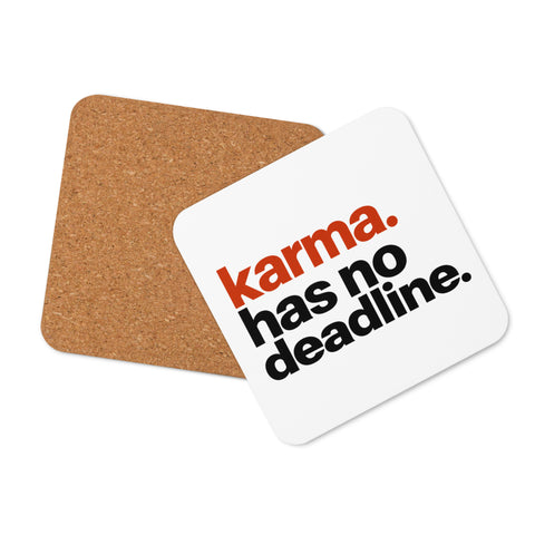 White square cork-back coaster with rounded corners and the original karma. has no deadline. design in rust-orange and black lettering.