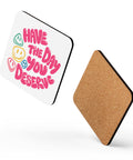 Glossy white cork-back coaster with original pink Have the Day You Deserve lettering and colourful smiley faces centred in full – ZIPZAPPA
