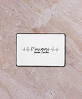 Money Pulse 12 × 18 inch desk mat with complete Lithuanian Pinigai lettering and black heartbeat line centred on white – view 2