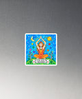 In Flow with the Universe colourful square chakra magnet with seated figure, stars and planets – on black circular metal surface