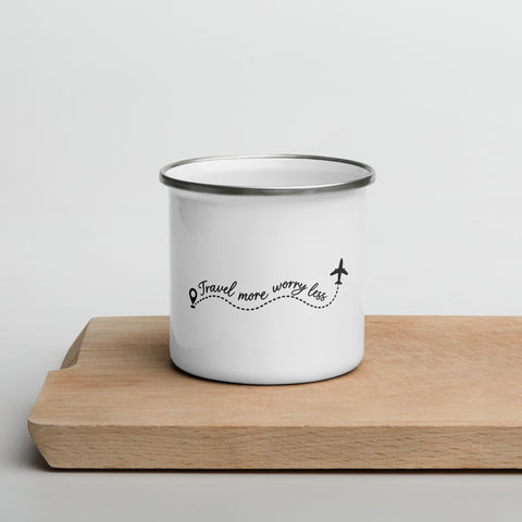 White Travel More, Worry Less enamel camping mug with a silver rim on a wooden tray, showing one complete black travel quote and aeroplane design.