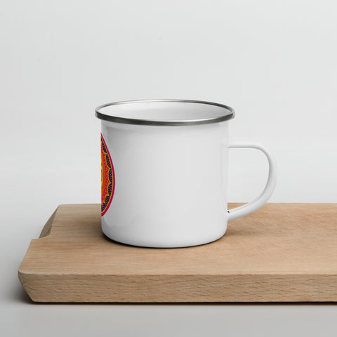 White 12 oz enamel mug with a silver rim and a pink, purple and golden-orange Om mandala on the front, shown on a wooden board; right-side view.
