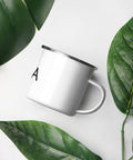 White 12 oz enamel camping mug with a silver rim and black Yoga wordmark with a seated meditation figure in the O, printed once on the front – ZIPZAPPA