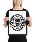 Person holding a vertical 30 × 40 cm Geometric Skull poster in a black frame