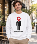 White Find Yourself premium crewneck sweatshirt worn outdoors, with red map pin head, black figure and complete find yourself lettering