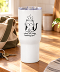 Grumpy Cat travel mug on a sunlit kitchen counter beside keys and a canvas bag, ready for the daily commute.