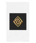 Golden Loop white hand towel with gold-tone geometric emblem on black square – front view