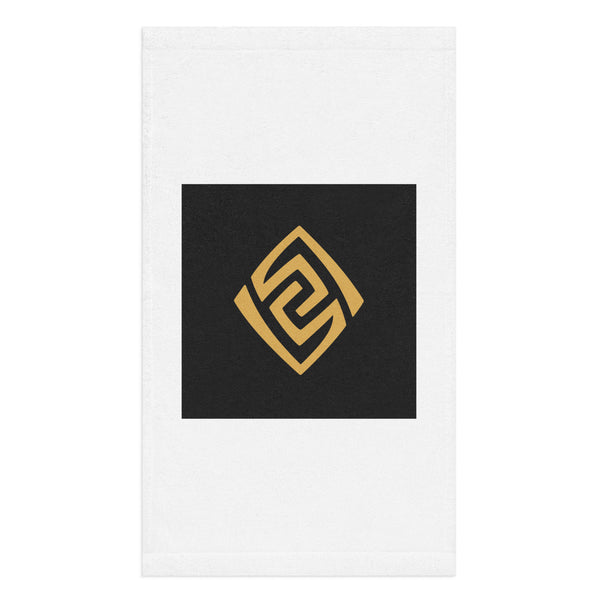 Golden Loop white hand towel with gold-tone geometric emblem on black square – front view