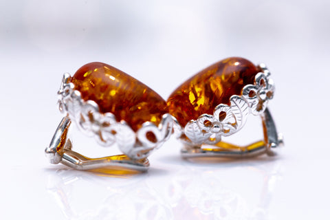 Boucles d'oreilles à clip ovales ambrées à motif floral