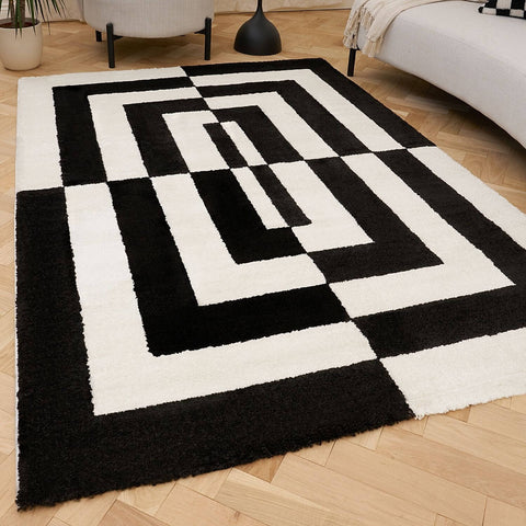 Joli tapis géométrique noir et blanc