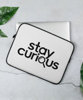 White 13-inch laptop sleeve with original Stay Curious magnifying-glass wordmark on the front – mockup 2 – ZIPZAPPA
