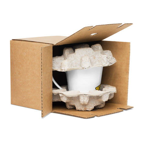 White Buddha Is My Homeboy latte mug protected by moulded packing inserts inside an open cardboard box.