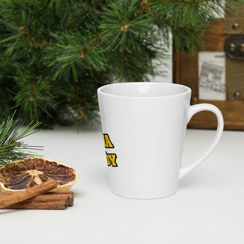 Right-side view of a white Buddha Is My Homeboy latte mug beside pastries and green branches.