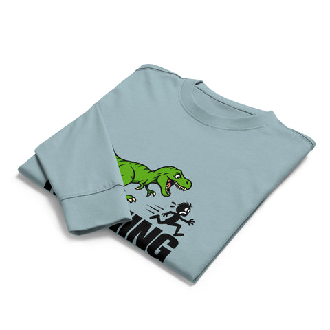 Folded front view of the Agave Dinosaur Motivation men’s heavyweight long-sleeve tee, showing its single green dinosaur and running quote front print.