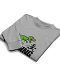 Folded front view of the Carbon Grey Dinosaur Motivation men’s heavyweight long-sleeve tee, showing its single green dinosaur and running quote front print.