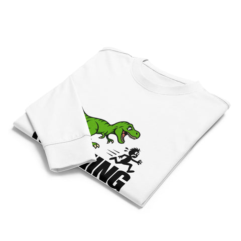 Folded front view of the White Dinosaur Motivation men’s heavyweight long-sleeve tee, showing its single green dinosaur and running quote front print.