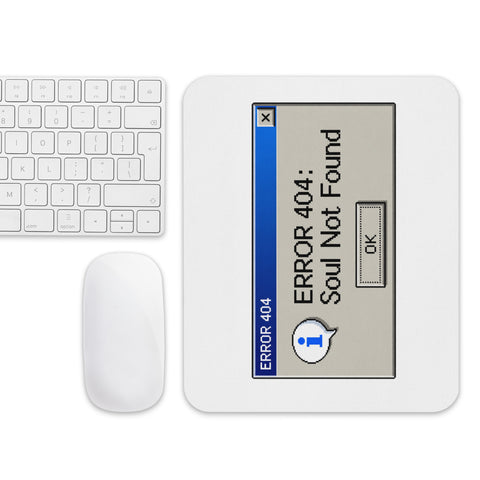 White Error 404 Soul Not Found retro mouse pad on a desk beside a white keyboard and mouse, showing the entire blue-and-grey error dialog design.