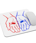 White mouse pad with two original red and blue illustrated hands holding matching capsules, centred in full on the surface – ZIPZAPPA