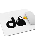 White mouse pad with original bold black d and cartoon bomb with a red-and-yellow fuse spark, centred on the surface – ZIPZAPPA