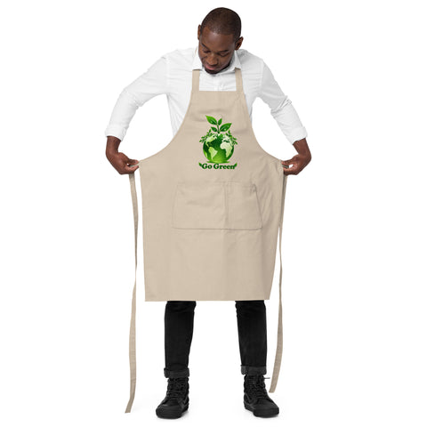 Man wearing a Rope organic cotton apron with green leafy Earth artwork and Go Green lettering above a two-compartment pocket.