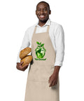 Man wearing a Rope organic cotton apron with green leafy Earth artwork and Go Green lettering above a two-compartment pocket.