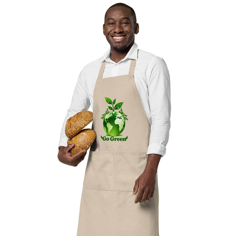 Man wearing a Rope organic cotton apron with green leafy Earth artwork and Go Green lettering above a two-compartment pocket.