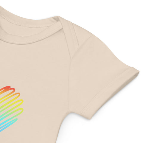Close-up of the organic natural Rainbow Heart bodysuit shoulder and rainbow front print.