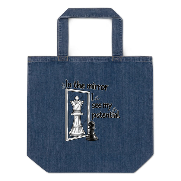 In the Mirror I See Potential organic denim-blue tote bag with large chess pawn and king illustration – front