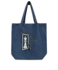 In the Mirror I See Potential organic denim-blue tote bag with large chess pawn and king illustration – front flat lay