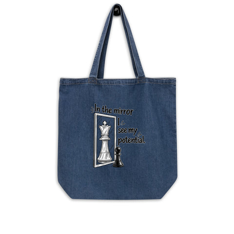 In the Mirror I See Potential organic denim-blue tote bag with large chess pawn and king illustration – front flat lay